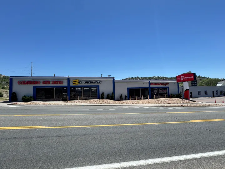 Long commercial storefront building with several business entrances